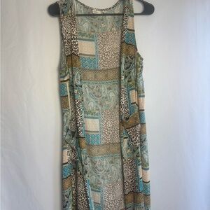Cato brand 
long sleeveless open-front cardigan 
or duster vest